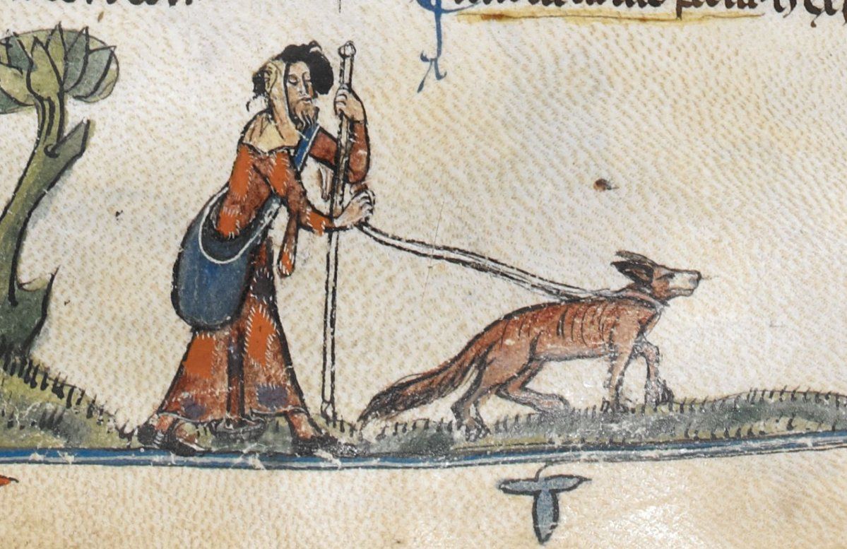 medieval blind man with guide dog